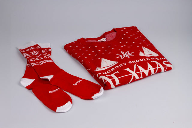 Pack de productos“Nobody should die at Xmas" Jersey y Calcetines